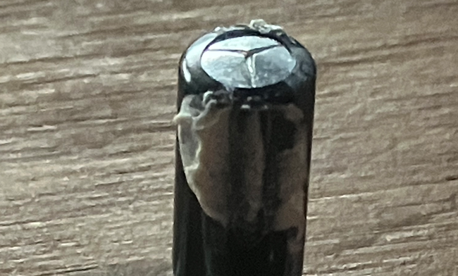 Original and damaged 470uF Capacitor